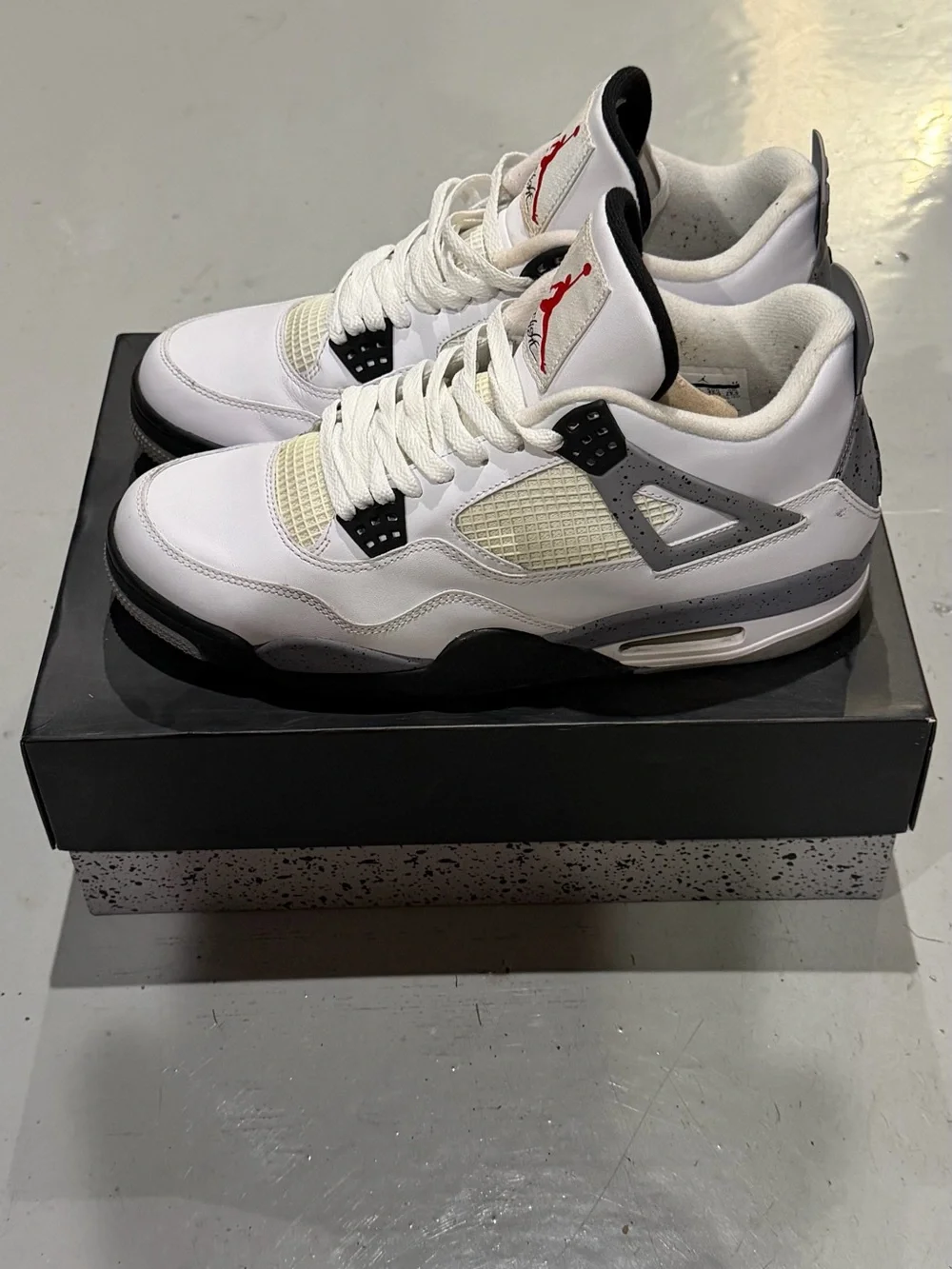 Jordan Men’s White/ Cement Gray/Black Retro 4 Sneakers with Red Jumpman